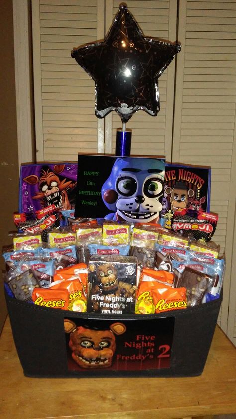 Five Nights at Freddy's gift basket with Little Debbie snack cake and Reese's peanut butter cups and Reese's minis Batman Gift Basket, Fnaf Gifts, Fnaf Birthday, Little Debbie Snack Cakes, Easter Basket Themes, Debbie Snacks, Dollar Tree Gifts, Reese's Peanut Butter Cups, Batman Gifts