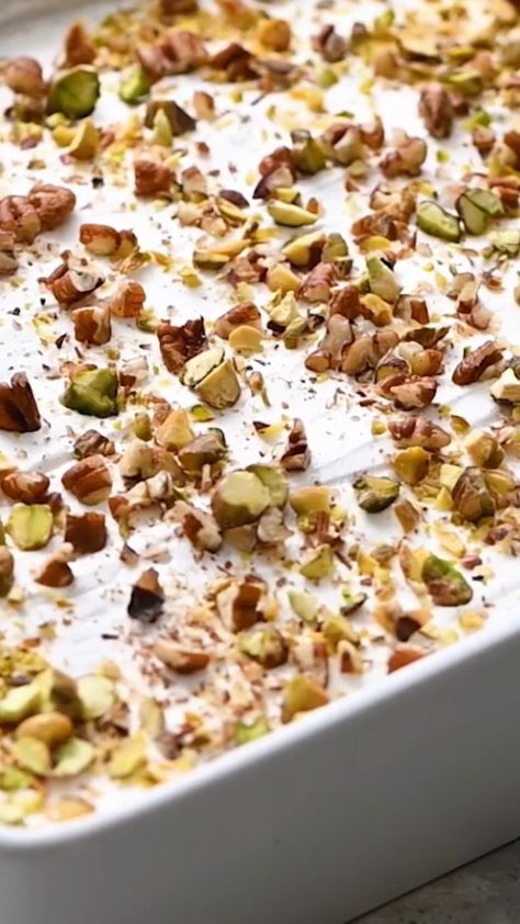 Recipe Here: https://therecipecritic.com/pistachio-dessert/ This layered pistachio dessert is insanely delicious! It has the perfect crust, topped with layers of creamy cheesecake and pistachio pudding. | Tried and True Recipes | Pistachio Dessert, Tried And True Recipes, Pistachio Pudding, Creamy Cheesecake, Tried And True, Easy Snacks, Pistachio, Sweet Treats, Cheesecake