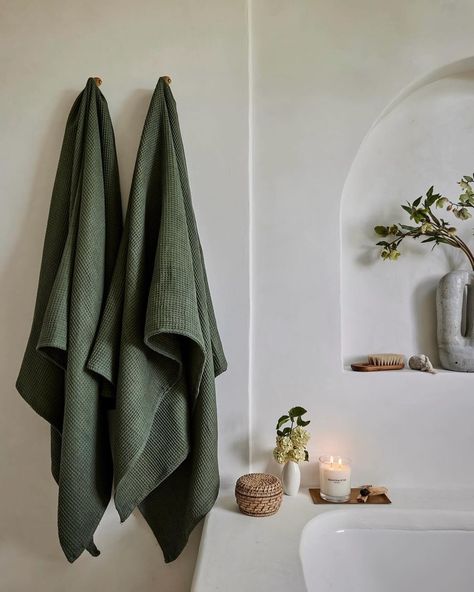 @bed.threads recently shot their new product colorways in our home, and the photos they’ve shared so far are beyond. This green in the tower bath though!!!! Heavenly. 😍🌿🍃 . . . 📸 creds @jennapeffley #bedthreads #bathroominspo #dreambathroom #calmbathroom #bathroomdesign #homedecor #bathroomredesign #redesign #dreamybathroom #olivebathroom Green Towels Bathroom, Neutral Bathroom Decor Ideas, Tranquil Bathroom, Neutral Bathroom Decor, Green Hand Towels, Bed Threads, Holiday Living Room, Simple Bathroom Decor, Neutral Bathroom