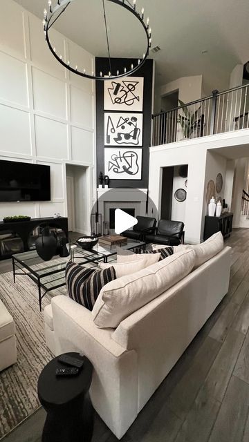 Kimberly  Cherie Moore on Instagram: "Dealing with high ceilings can sometimes be overwhelming as you figure out what to add to the space. However, incorporating millwork can be a great way to address this. Also, when thinking about purchasing art for your walls, it’s important to choose pieces that fit the scale of your space for a cohesive look." Tv On Wall With High Ceiling, Tv Wall High Ceiling, High Ceiling Tv Wall Ideas, Living Room With High Ceilings, Round House Plans, Ohio House, Ceiling Tv, High Ceiling Living Room, Angled Ceilings