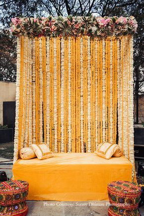 Davina and Nikhil | The Lalit | Chandigarh Wedding | WeddingSutra Sangeet Decorations, Indian Outdoor Wedding Decor, Haldi Decoration Ideas, Haldi Ceremony Decorations, Orange Marigold, Mehendi Decor Ideas, Haldi Decor, Wedding Hall Decorations, Wedding Decor Photos