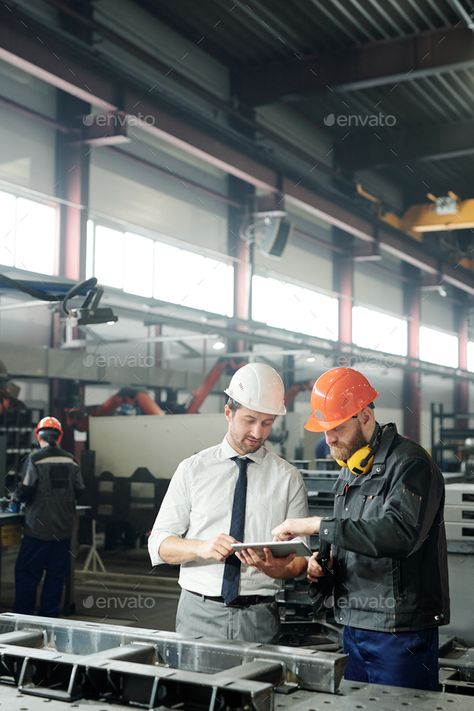 Engineering industrial machine by Pressmaster. Technician in formalwear using tablet while engineering industrial machine with factory worker in workshop #Sponsored #Pressmaster, #Technician, #machine, #Engineering Industry 4.0, Industrial Engineering Aesthetic, Engineer Photoshoot, Manufacturing Aesthetic, Engineering Photos, Engineering Industrial, Factory Photography, Virtual Families, Job Pictures