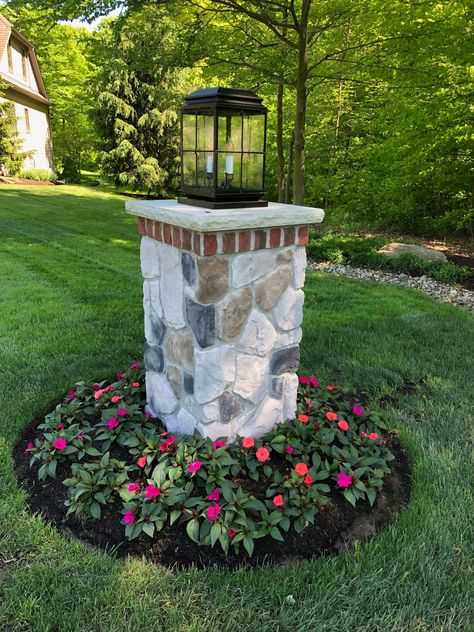 Finally we're thinking SPRING 🌷 Have you planted your flowers for the season yet? #madeinusa #curbappeal #homedecor #exteriordesign #howyouhome #architecturaldigest #lightingdesign #outdoorlighting #homeinspo  #homeinspiration  #homeideas #designinspiration #homeexterior #remodeling #TowerLighting #outdoorliving #outdoorspace #luxurydetails #frontporchliving #frontporchdecor #instadesign #lightingstyle #exteriorsofinstagram #thinkspring #postlights #plantflowers #lantern #homebeautful Brick Pillars, Entrance Landscaping, Driveway Entrance Landscaping, Driveway Lighting, Outdoor Lamp Posts, Tower Light, Driveway Entrance, Front Yard Ideas, Lantern Post