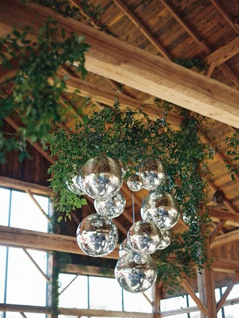 Rustic Disco Ball Wedding, How To Hang Disco Ball, Greenery With Disco Balls, Disco Ball Installation Wedding, Hanging Disco Balls Wedding, Greenery And Disco Balls, Disco Ball Greenery, Greenery And Disco Balls Wedding, Disco Ball Florals