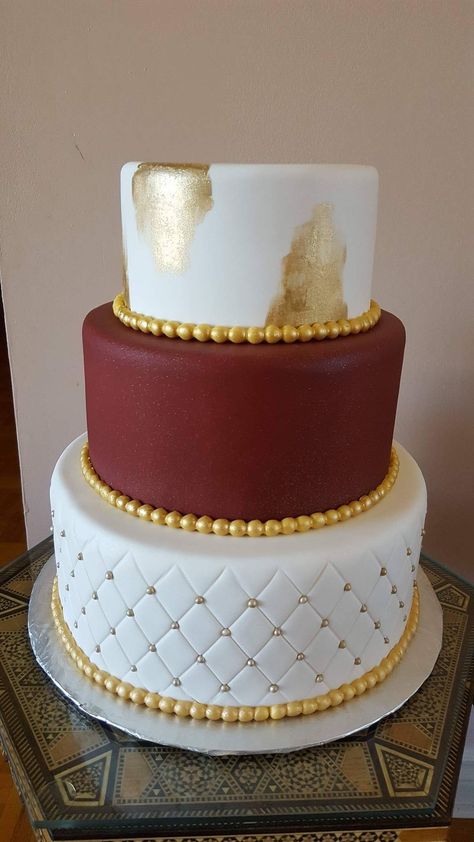 White, gold and burgundy wedding cake Maroon And Gold Graduation Cake, White Gold And Burgundy Wedding, Maroon And Gold Cake, Gold And Burgundy Wedding Cake, Quinceañera Cakes, Wedding Cakes Maroon, Asu Graduation, Gold And Burgundy Wedding, Cream Wedding Cakes