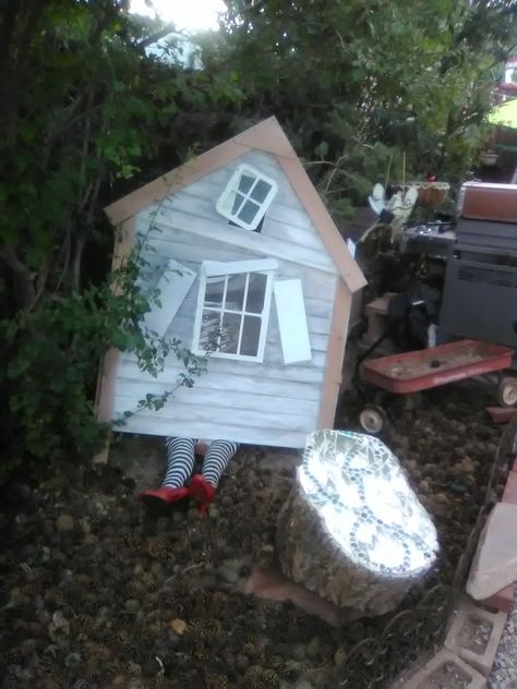 Dorothy's House, landed in Munchkin Land!!! Dorothy’s House Wizard Of Oz, Wizard Of Oz House Costume, Wizard Of Oz House On Witch, Munchkin Land Decorations, Wizard Of Oz House Diy, Munchkin Land Wizard Of Oz, Wizard Of Oz House, Witches Caldron, The Wizard Of Oz Costumes