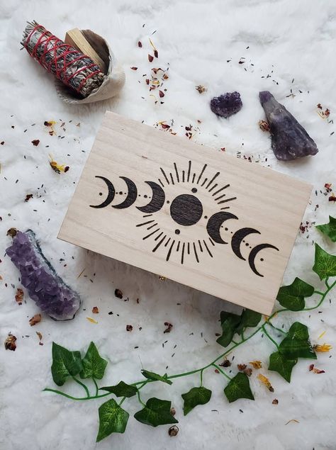 This beautiful moon phase box will add beauty and joy into your space. Each is made with love and positive intention. 💖💫 Each box is burned by hand using a commercial use design and no two are burned alike. I do not use a machine, just a tool so your image may burn in different depths and variations. I purchase my boxes; they are lightweight and may have imperfections because wood is imperfect! This includes slightly offset latches. I do my best to choose the best boxes. The box is roughly 8.4 Witch Boxes, Wooden Box Crafts, Wooden Memory Box, Painted Wooden Boxes, Jewelry Box Diy, Wood Burning Crafts, Crystal Box, Wood Burning Patterns, Wood Burning Art