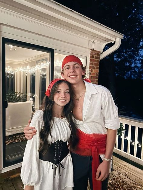 DIY Couples Halloween Outfits For You And Your BOO - RecipeMagik Pirate Diy Costume Mens, Pirate And Parrot Costume Couple, Pirate Costumes For Couples, Pirates Couple Halloween Costumes, Pirates Couples Costume, Jack Sparrow Couple Costume, Pirate Couple Halloween Costumes, Will Turner And Elizabeth Swan Costume, Diy Pirate Costume Men