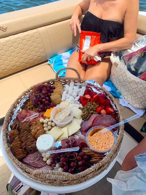 Charcuterie assortment of fruits, cheese, crackers, and meat in wicker basket on a boat Breakfast On Boat, Boat Party Snacks, Boat Day Food Ideas, Boat Charcuterie Board, Boat Charcuterie, Charcuterie Basket, Boat Snacks, Charcuterie Box, Miami Boat