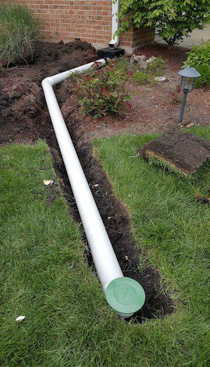 A pop-up drain emitter is part of a system that more efficiently carries water away from a house’s foundation than a standard downspout. Gutter Drainage, Landscape Drainage, Backyard Drainage, Yard Drainage, Drainage Solutions, Handyman Services, Kew Gardens, Backyard Projects, The Grass