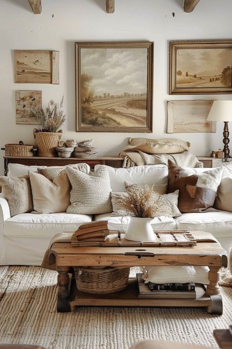 Explore living room wall art layout ideas that create a cozy and inviting atmosphere. Embrace vintage and rustic elements for a warm space. 🌿✨ Clean Home Decor Ideas, Country Home Living Room Decor, Natural Vintage Interior, Beige Cottage Living Room, Sophisticated Country Decor, Mountain Cottage Living Room, Vintage Modern Farmhouse Decor, Rustic Modern Farmhouse Living Room Decorating Ideas, Cozy Cottage Living Room Farmhouse Style