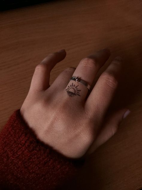 sunset tattooed finger with ring Sunrise Tattoo On Finger, Tattoos For Him About Her, Before Sunrise Tattoo, Sunset Sunrise Tattoo, Sunrise Tattoo, Sunshine Tattoo, Song Tattoos, Sunset Tattoos, Tiny Tattoo