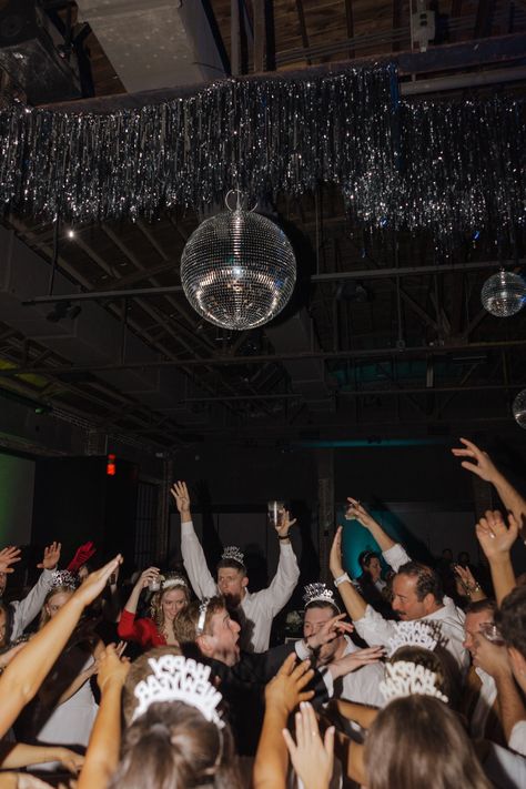 nye-wedding-new-years-eve-wedding-december-the-record-bentonville-arkansas-bride-wedding-dress-bride-kansas-city-KC-black-tux-groom-long-veil-pearl-earrings-big-white-bouquet-classic-classy-timeless-bride-and-groom-poses-pose-disco-ball-checker-dance-floor-black-white-silver-reception-kiss-at-midnight-direct-flash Avante Garde Wedding, Checkered Dance Floor, Wedding December, Veil Pearl, Timeless Bride, Serenity Garden, New Years Eve Wedding, New Years Wedding, Bentonville Arkansas