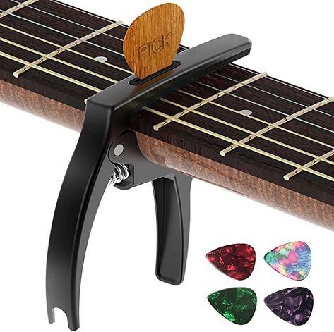 "Problem: My guitar playing lacked that extra edge. Solution: The TANMUS 3in1 Zinc Metal Capo! It gives my chords a fresh new perspective and keeps my picks within reach. Amazon, you've turned my musical journey into a cool adventure! https://amzn.to/3NOm3ss " Capo Guitar, Guitar Capo, Guitar Pins, Pick Holder, Fingerstyle Guitar, Guitar Center, Guitar Neck, Guitar Strings, Guitar Accessories