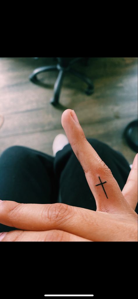 cross tattoo Tiny Cross Finger Tattoo, Cross On Inside Of Finger, Small Cross On Finger Tattoo, Red Cross Finger Tattoo, Tattoos Of Crosses For Women, Cross On Middle Finger Tattoo, Small Cross Finger Tattoo, Small Cross Finger Tattoos For Women, Cross Ring Finger Tattoo