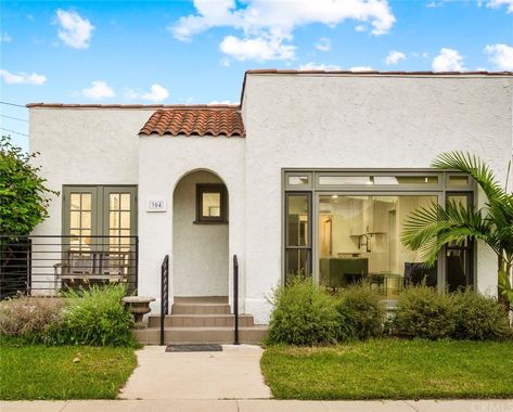 Flat Roof Spanish Style Homes, Flat Roof Spanish House, Spanish Style Home White Exterior, White Brick Mediterranean House, White Stucco House With Clay Tile Roof, White Stucco White Windows, Small Two Story Spanish Style Homes, Spanish Windows, Modern Spanish House Exterior