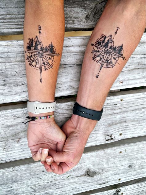 Used each others first initial as True North Outdoors Couple Tattoos, Hiking Couple Tattoo, Compass Tattoo With Initials, Astrology Couple Tattoo, Outdoor Couples Tattoos, True North Tattoo For Women, Couple Compass Tattoo Love, Couple Tattoo Mountain, Matching Adventure Tattoos