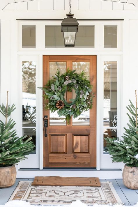 Need some easy, budget-friendly ideas for your Christmas front porch? We’ve got tons of simple ways to add holiday charm, like festive wreaths, twinkling lights, and cozy blankets for a welcoming vibe. It doesn’t take much to create a festive entrance! Let’s keep it cheerful and easy. #christmasporchdecor #holidayfrontporch #simplechristmasporch Christmas Porch Modern, Christmas Decor With Houseplants, Modern Christmas Porch Decor, Minimalist Door Design, Simple Christmas Front Porch, Modern Christmas Decor Ideas, Christmas Party Inspiration, Christmas Front Porch Ideas, Holiday Interior