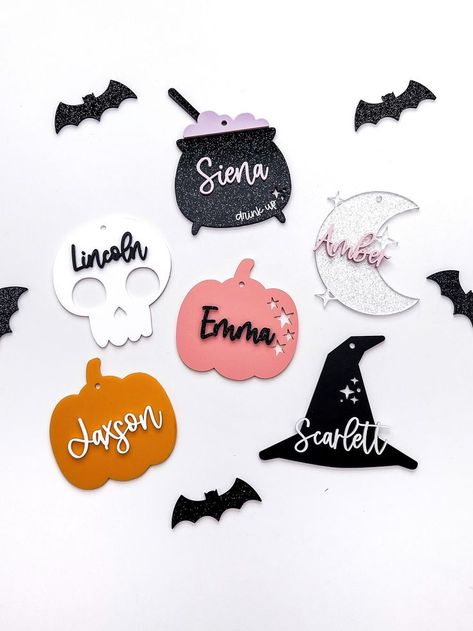 Personalized Halloween name tags. Perfect for a little custom touch to boo baskets or trick or treat baskets/ bags! .: ORDER :. Choose from the drop down menu the design you would like and then select your material/ color of choice for your 3D lettered name. CAULDRON - the bubbles for the cauldron will be the same color as the name color that is chosen. .: COLOR / SIZE APPROX :. Cauldron (glitter black) - 3 1/4 x 4 1/4 Skull (white) - 3 1/4 x 3 1/2 Moon & Stars (glitter clear) - 3 1/2 x 3 3/4 Pumpkin w/ stars (coral) - 3 1/2 x 3 1/2 Pumpkin (orange) - 3 1/2 x 3 1/2 Witch hat (black) - 4 1/4 x 3 1/2 .: PERSONALIZATION :. Please leave the name you would like on the tag in the personalization box along with your ribbon/twine selection. Halloween Glowforge, Halloween Name Tags, Christmas Ornament Favors, Acrylic Name Tags, Creepy Crafts, Nametags For Kids, Boo Baskets, Halloween Gift Baskets, Halloween Names