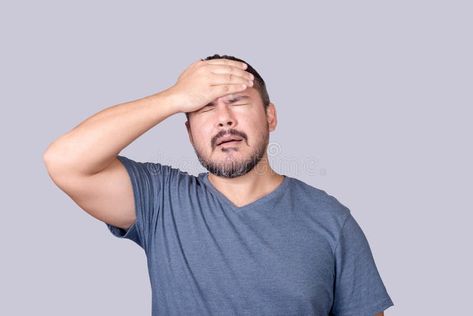 A man face palms, slapping his forehead in frustration. Feeling embarrassed or dismayed stock photography Feeling Embarrassed, Migraine Attack, Man Face, Migraine, Male Face, Stock Photography, A Man, Massage, Photo Image