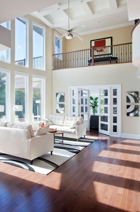 This is a beautiful soaring white coastal style living room with hardwood flooring, view of the upper landing and 2-story windows. 2 Story House Plans, Formal Living Room Designs, Coastal Style Living Room, 2 Story House, High Ceiling Living Room, Cathedral Ceilings, Coastal Living Rooms, Trendy Living Rooms, Living Room Windows