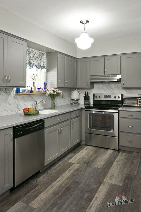 A grayscale kitchen palette lets the style shine through. 🖤 #graykitchens #kitchendesign #kitchendesignideas #gray #graykitchen #graycabinets #greykitchens Laminate Kitchen Cabinets, Hardwood Floors In Kitchen, Kitchen Design Gallery, Laminate Kitchen, Gray Cabinets, Remodeling Kitchen, Design Your Kitchen, Kitchen Gallery, Grey Kitchen Cabinets