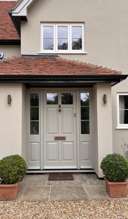 Statement-making entrance doors | The Burgess Group Front Door For White House, Front Door With Porch, Front Door Bungalow, Bungalow Porch Ideas Uk, Kerb Appeal Uk, Front Gardens Uk, Modern Front Porch Ideas Entrance, 1940s Home Exterior, Porch Ideas Entrance