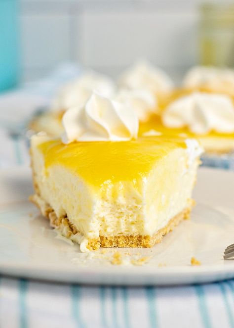 No Bake Lemon Cheesecake is a delicious alternative to baked cheesecake. Tart lemon mixed with sweet creamy cheesecake makes this recipe a hit every time. Lemon Meringue Cheesecake No Bake, Recipe With Lemon Curd In Them, Lemon Cheesecake With Condensed Milk, Lemon Cheesecake Pie No Bake, Lemon Curd No Bake Cheesecake, Lemon Pie Cheesecake, Lemon Cream Cheese Pie No Bake, Gf No Bake Cheesecake, Lemon Meringue Cheesecake Recipe