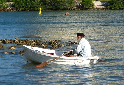 man rowing fishing boat | Row Boat | Free Stock Photo | A man in a row boat in the ocean ... Man Rowing Boat, Boat In The Ocean, Men's Rowing, Rowing Boat, Row Boat, In The Ocean, Rowing, Fishing Boats, The Rock