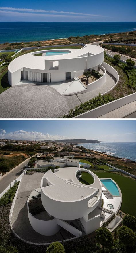 Mario Martins Atelier have designed this modern and sculptural house in Luz, Portugal, that's based on the geometric shape of an ellipse. Futurist Architecture, A Modern House, Landscape Architecture Design, Architecture Design Concept, Scandinavian Interior Design, Village House Design, Modern Architecture House, Traditional Architecture, Futurism