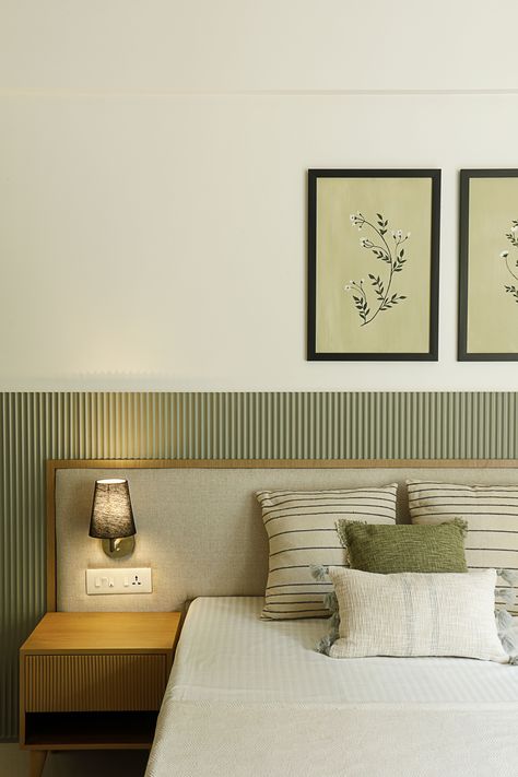 Parent’s Bedroom -This bedroom has a delicate fluted panel in moss green shade as a backdrop for bed and TV. The arched wardrobe and dressing panels in raw wooden textures allow it to blend seamlessly with the theme. The contrasting black linen lights on the headboard and long white curtains makes the room warm and cozy. Colour Palette Home Interior Design, Interior Design Hotel Room, Minimalistic Interior Bedroom, Rooms Interior Bedroom, Bedroom Headboard Design Modern, Colour Palette For Bedrooms, Parents Room Design, Bed Back Design Headboards, Headboard Design Modern Bedhead