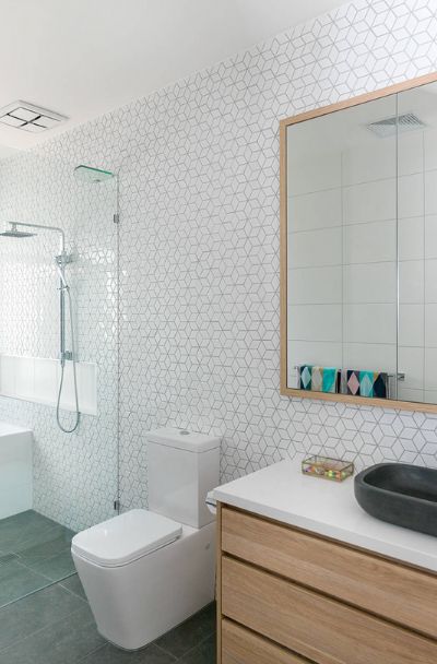 23 Geometric Shaped Tile Design Ideas For Your Kitchen & Bath | Sebring Design Build Geometric Tile Bathroom, White Geometric Tile, Geometric Tiles Bathroom, Design Ideas For Kitchen, Geometric Tile Design, Tile Design Ideas, Geometric Tile Pattern, Triangle Tiles, Kitchen Splashback Tiles