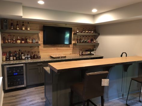 Cypress shiplap, floating shelves Basement Bar With Floating Shelves And Tv, Bar With Floating Shelves And Tv, Bar Rooms In House, Basement Bar With Floating Shelves, Black Shiplap Bar, Basement Sports Bar Ideas, Floating Shelves Bar, Wall Bar Ideas For Home, Bar Floating Shelves