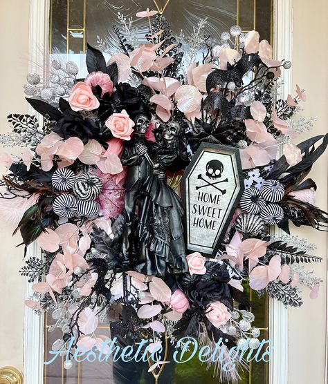 "This skeleton couple is,\"Home Sweet Home\",and surrounded by glittering accents in pink, silver and black. This is eye catchingly creepy.    This wreath is created on a, \"Patent Pending\", wreath base of my own design created from a wood frame and chicken wire ribbon. Wreath base measures about 18\" in diameter about 28\" with the extended foliage.   FREE GROUND SHIPPING! Depth is approximately 8\" Wreath has been sprayed with a UV protectant to reduce sun damage. If this wreath is used outdo Skeleton Hand Wreath, Pink And Black Wreath, Pink Halloween Wreath, Diy Halloween Wreath Dollar Tree, Chicken Wreaths, Creepy Wreath, Wire Ribbon Wreath, Halloween Wreath Ideas, Creepy Crafts