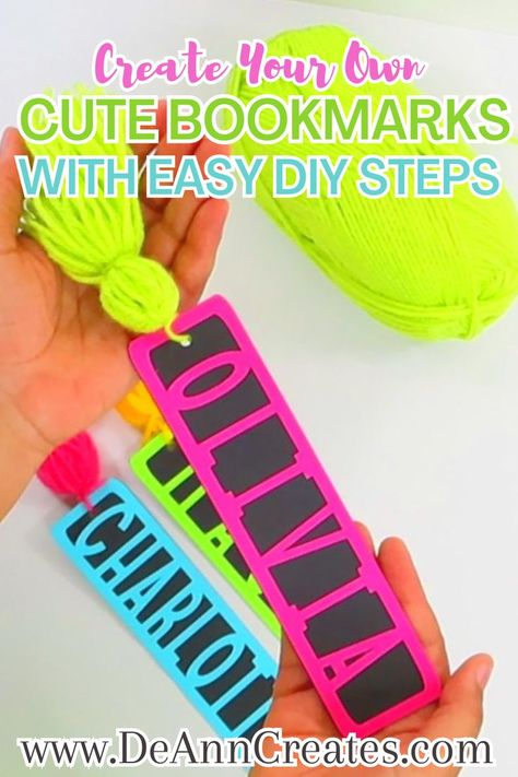 This image shows a pair of hands holding a colorful bookmark with a tassel while two other bookmarks lay on the surface below.  There is also a ball of lime green yarn near the bookmarks as well. Diy Name Bookmark, Personalized Bookmarks Diy, Cardstock Bookmarks Diy, Book Marks Cricut, Cricut Bookmark Ideas Cardstock, Svg Bookmarks Free, Bookmark Cricut Ideas, Bookmarks Diy Cricut, Diy Book Markers