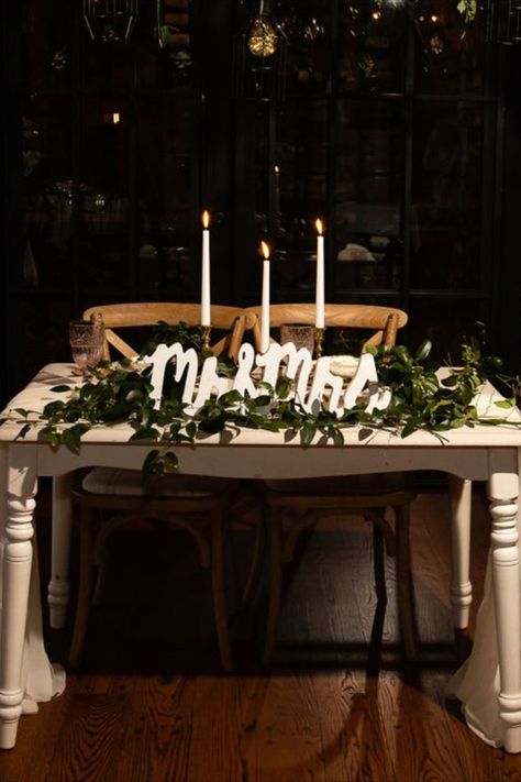 Wedding sweetheart table with greenery, a Mr and Mrs and candles. Sweetheart Table Seating, Simple Sweetheart Table, Romantic Sweetheart Table, Rustic Sweetheart Table, Wedding Sweetheart Table Decor, Head Table Wedding Decorations, Cedar Sage, Champagne Wall, Sweetheart Table Decor