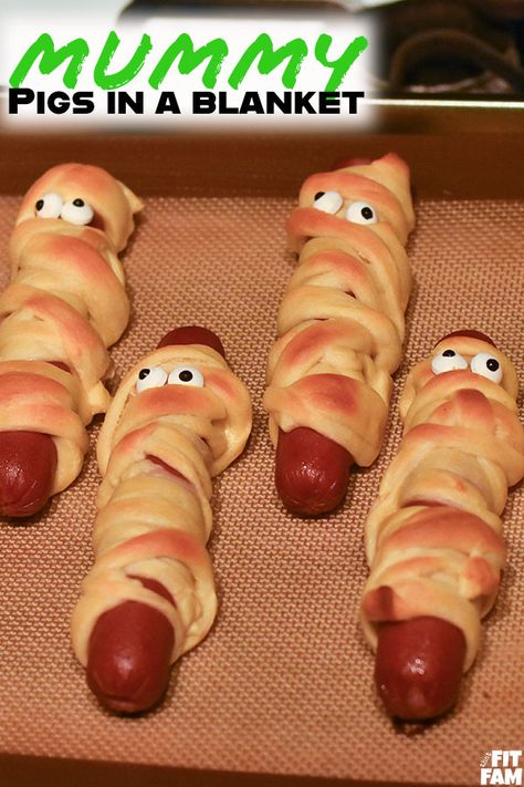 Mummy Pigs in a Blanket - That Fit Fam Mummy In A Blanket, Mummies In A Blanket, Halloween Pigs In A Blanket, Mummy Pigs In A Blanket, Frozen Party Snacks, Halloween Themed Foods, Food For Halloween, Quarantine Party, Halloween Sleepover