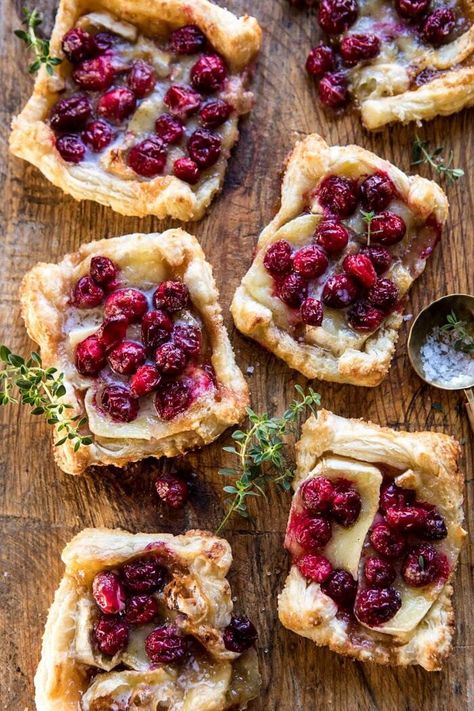 Cranberry Brie Pastry Tarts | halfbakedharvest.com #brie #cranberries #appetizers #thanksgiving #christmas Thanksgiving Food With A Twist, Thanksgiving Recipes With Cranberries, Thanksgiving Twist Recipes, Twist On Thanksgiving Recipes, Creative Thanksgiving Side Dishes, Thanksgiving Pastry Desserts, Non Traditional Thanksgiving Recipes, Thanksgiving With A Twist, Thanksgiving Creative Food