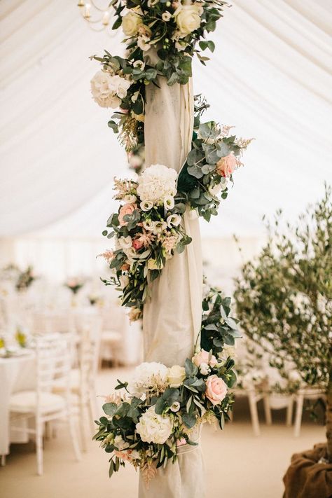 Marquee Poles With Floral Decor Boho Floral Wedding Decor & Bohemian Wedding Decorations - With beautiful peach soft blush pinks floral & elegant floral wreath! Perfect for Fall, Floral & Romantic Weddings! Flowers On Poles Wedding, Post Wedding Party Decorations, Decorating Marquee Wedding, Decorate Poles For Wedding, Decorating Poles For Wedding, How To Decorate Poles For Wedding, Flowers On Columns Wedding, Wedding Pillars Decorations, Wedding Pole Decorations