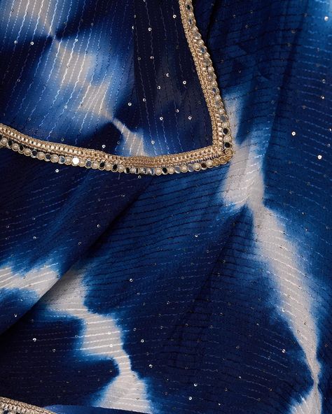 Indulge in luxury with our Graceful Navy Blue Shibori Self-Embroidered Lehenga. Featuring intricate self-embroidery and contrasting blouse, this lehenga will make you stand out in any occasion. Complete the look with the matching dupatta for a touch of elegance. Elevate your style and be the center of attention. #sujatra #sujatraglobal #sujatralehenga #readymadelehenga #readytowear #stitchedlehengacholi #lehengacholi #shibori #selfembroidered #shiborilehenga Lehenga With Contrast Blouse, Embroidered Lehenga, Contrast Blouse, Lehenga Choli, Shibori, Lehenga, Return Policy, Ready To Wear, Size Chart