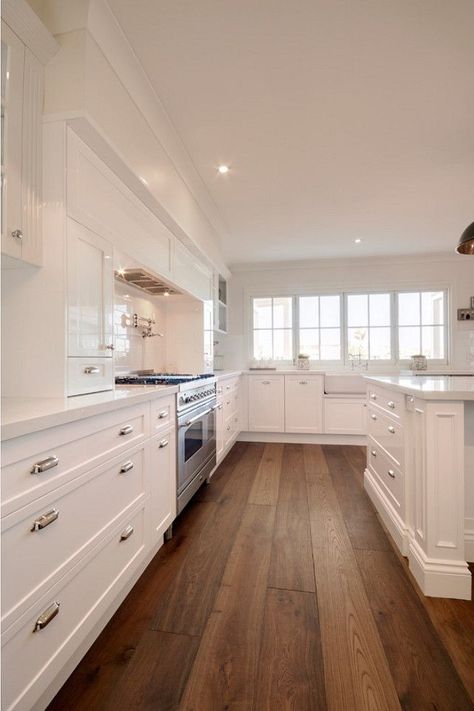 Clean white kitchen design with wood floor Luxury White Kitchen Design, Luxury White Kitchen, Hardwood Plank Flooring, Timeless Kitchen Design, Wood Floor Kitchen, Kabinet Dapur, Wood Floors Wide Plank, Timeless Kitchen, Wood Laminate Flooring