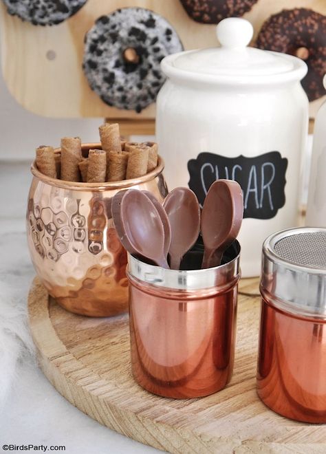 How to Style a Coffee and Donuts Bar for a Party - easy, quick and inexpensive DIY craft projects and ideas to set up a drinks station for entertaining: DIY Rae Dunn inspired mugs, coffee and sugar canisters, custom coffee syrup bottles and a donuts wall! by BirdsParty.com @birdsparty #coffeebar #coffeestation #diycoffeebar #coffeedonutspartyideas #partyideas #winterparty #babyshower #bridalshower #donutsparty #donutswall #diydonutswall #diydonutsboard #donutsbirthday #raedunn #diy #crafts Coffee Cup Party Favors, Coffee House Theme Party, Donut And Coffee Bar, Iced Coffee Bar Ideas Party, Coffee Bar Party Ideas, Coffee Party Decorations, Coffee Party Ideas, Coffee Themed Party, Donuts Wall