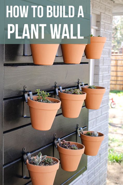 There is always something to add to your yard! Why not add a plant wall? Check out how to build a wood plant wall in this article! #pots #vertical #wall Porch Plant Wall, Living Plant Wall Outdoor, Outdoor Plant Wall Ideas Patio, Patio Plant Wall, Diy Plant Wall, Potted Plant Wall, Vertical Plant Wall, Vertical Garden Pots, Wall Planters Outdoor