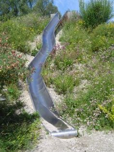 Hillside slide through a sea of wildflowers. Description from pinterest.com. I searched for this on bing.com/images Hillside Slide, Backyard Slide, Large Backyard Landscaping, Sloped Backyard, Sloped Garden, Natural Playground, Large Backyard, Backyard Playground, Backyard Play