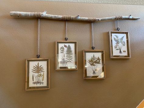 This truly is an easy DIY project. I bought four framed prints and added some decorative hooks on top of the frames. I found a fallen Aspen tree (any straight tree will work) that would serve as a perfect branch to hang the pictures. I bought some jute and looped it through the hooks. I then wrapped each along the tree at random lengths with screws on the back. I hung using screws into studs in the wall. This added the perfect touch needed in our stairway of our mountain home!! Wooden Branch Decor, Wood Branch Wall Decor, Hanging Birch Branch Decor, Tree Branch Wall Hanging, Rustic Hanging Decor, Diy Wood Branch Projects, How To Hang A Branch On The Wall, Tree Branch Decor Wall, Tree Branch Diy Projects