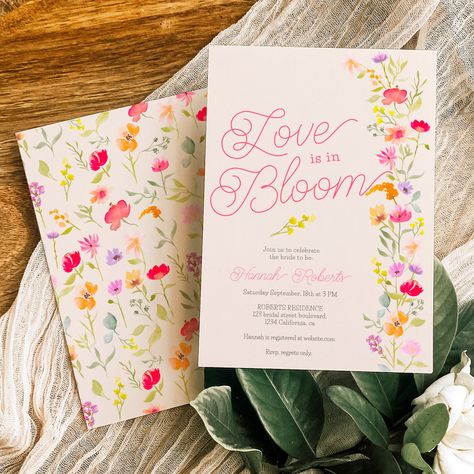 Love is in bloom wildflowers floral bridal shower featuring pretty hand painted vibrant and bright orange, pink and yellow flowers watercolor illustration with a modern elegant script font saying Love is in bloom, with bohemian greenery foliage on beige ivory. Perfect for Spring, summer outdoors garden bridal or wedding party. February Wedding Shower Themes, Wildflower Wedding Shower Theme, Love In Bloom Bachelorette Party, Flower Garden Watercolor, Love Is In Full Bloom Bridal, Bridal Shower Love In Bloom, Summer Wedding Shower Ideas, March Bridal Shower Themes, Love In Bloom Bridal Shower Theme Decor