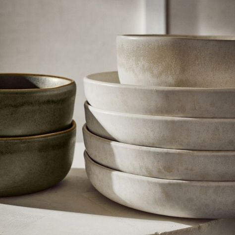 Expert craftsmanship leaves its mark on the Drift Pasta Bowl. Hand-pressed with a curved bottom and straight edges, wide stoneware form is coated with a matte ivory water-reactive glaze that behaves beautifully when kiln-fired. What surfaces is a subtle crackled texture in a rich tonal mix that makes each piece unique. Part of the Drift Reactive Ivory Dinnerware collection; also looks great with Drift Dinnerware in both lavender and green. CB2 exclusive.     Handmade  Stoneware  Matte ivory and West Elm Dinnerware, Clay Pasta Bowl, Mid Century Modern Dishware, Stoneware Serving Dishes, Pottery Serving Bowls, Pasta Bowls Pottery, Stoneware Table Setting, Unique Dishware, Ivory Dinnerware