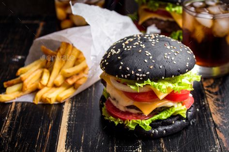 Black burger by its_al_dente. Black burger with meat patty, cheese, tomatoes, mayonnaise, french fries in a paper cup and glass of cold cola soda w... #Sponsored #cheese, #patty, #mayonnaise, #tomatoes Goth Food, Charcoal Burger, Burger Images, Black Burger, Mini Burger, Black Food, Nutrient Rich Foods, Edible Food, Nyc Food