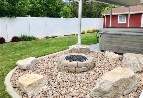 River rock patio with stone fire pit and bench rocks Patio Rocks, Concrete And Rock Patio, River Rock Patio Ideas, Pebble Stone Fire Pit Area, River Rock Sitting Area, River Rock Fire Pit Area, Fire Pit River Rock, Fire Pit With River Rock, River Rock Fire Pit