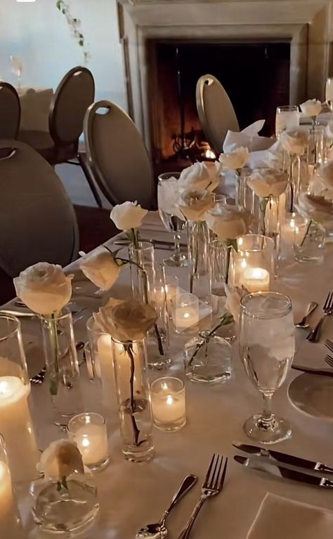 Minimalist White Rose Centerpiece, Simple White Rose Table Decor, Candle And Rose Centerpieces Wedding, Long Stem Rose Centerpiece Wedding, White Candles Wedding Table, Single Roses Centerpieces, Wedding Table Decorations White Roses, Candles Wedding Reception Table, Candle And Roses Centerpieces